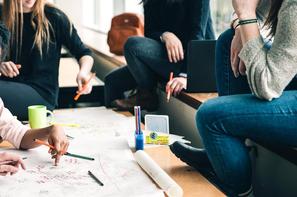 Diverse group of people collaborating in a modern learning environment